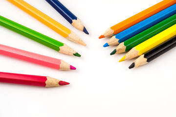 Colour Pencils Arranged on White Background with Copy Space