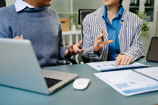 Team work process. Photo young business crew working with new startup project. Project managers meeting. Analyze plans, papers. At office