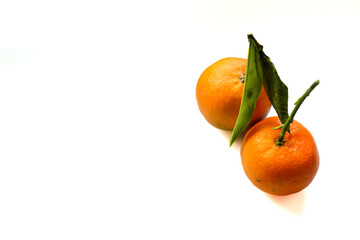 Fresh orange tangerines on the white background