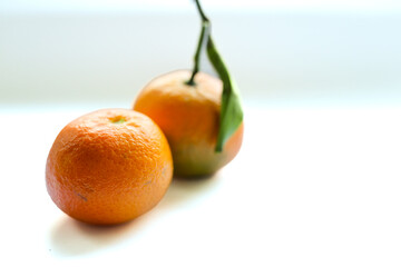 Fresh orange tangerines on the white background