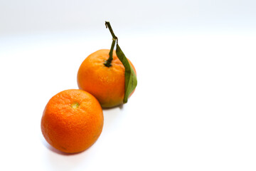Fresh orange tangerines on the white background