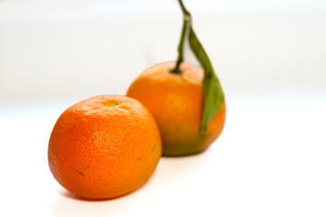 Fresh orange tangerines on the white background