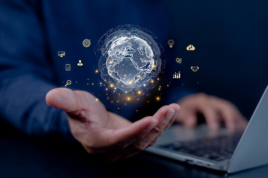 Businessman hand holding digital globe hologram with global network, data analytics, and technology icons Concept of global business connection innovation, and digital transformation for future growth