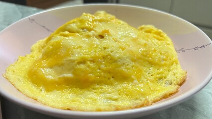 Table top view creamy omelet on rice.
