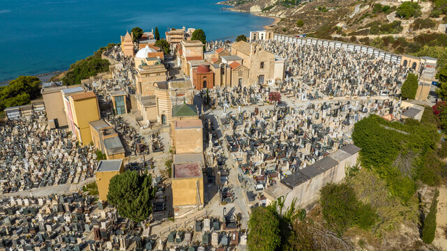 Aerial view of the cemetery of Licata, in the province of Agrigento, Sicily, Italy. It is a small Catholic cemetery overlooking the Mediterranean Sea.