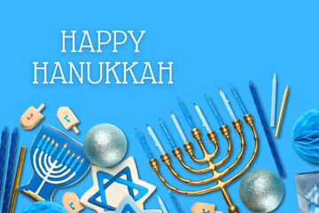 Hanukkah decor features menorahs and dreidels on blue background