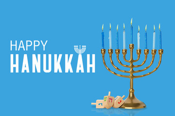 Menorah with lit candles and dreidels on a blue background