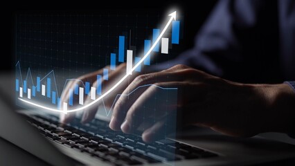 A business professional types on a laptop keyboard, while an animated growth graph overlays the scene, symbolizing success and progress in a modern office setup. Copula