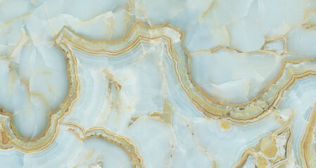 Blue and gold onyx marble texture with smooth translucent layers and flowing organic contours, perfect for luxury interiors, elegant backgrounds, decorative surfaces, and modern design projects.