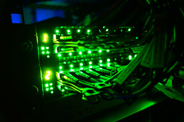 Bright Green Lights on Network Switch Rack