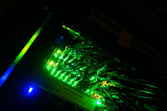 Bright Green Lights in Server Rack Depths - Powered by Adobe