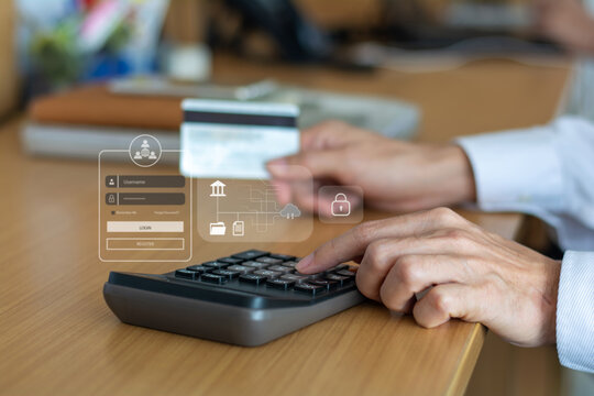 Close-up of hands using a calculator and credit card, illustrating secure online banking, digital payments, and financial account login processes. - Powered by Adobe