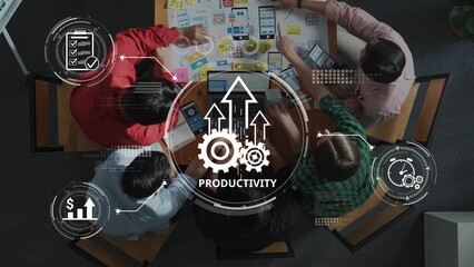 A dynamic overhead view of a collaborative workspace where team members engage in productive brainstorming and strategic planning using visual tools for improved results. Raster