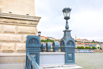 Architectural elements of historic Szechenyi Chain Bridge in Budapest, Hungary. Perspective of...