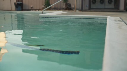 Surface of water in calm swimming pool with soft reflections - Powered by Adobe