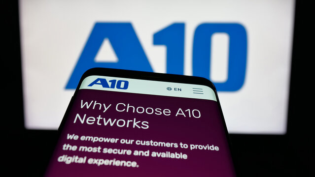 Stuttgart, Germany - 11-12-2025: Mobile phone with website of US company A10 Networks Inc. on screen in front of logo. Focus on top-left of phone display.