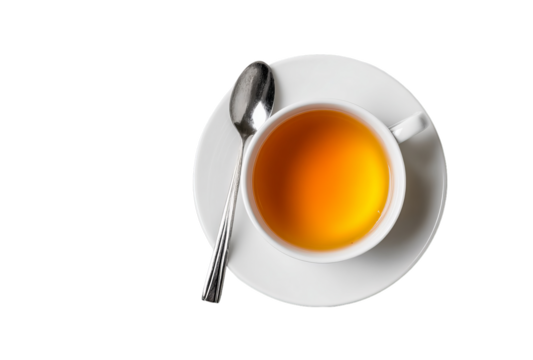 A close-up view of a steaming cup of tea accompanied by a silver spoon on a white saucer against a black background, showcasing the rich amber hue of the beverage on transparent background