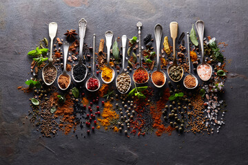 Herbs with spices on graphite board