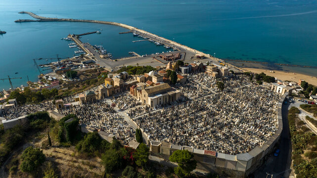 Aerial view of the cemetery of Licata, in the province of Agrigento, Sicily, Italy. It is a small Catholic cemetery overlooking the harbor on the Mediterranean Sea.