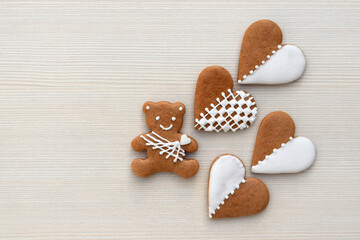 Gingerbread bear and hearts decorated with white icing, copy space for text