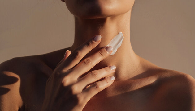 Minimalist skincare scene with hand gently applying soothing cream to neck area, soft warm lighting, healthy skin, self care, relaxation, and beauty routine