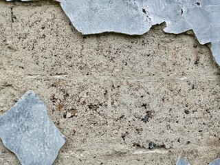 Concrete Wall with Cracked and Curling Paint Chips Weathered and Abandoned Look