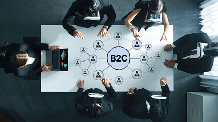 Business professionals collaborate in a modern workspace, utilizing virtual reality technology for innovative B2C market strategies and effective team engagement. Trope