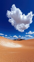 A striking desert landscape features swirling patterns in the sand under a vibrant blue sky with a large, dramatic cloud formation.