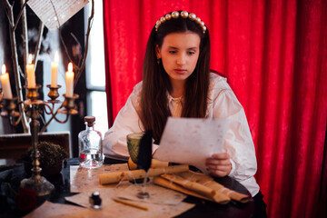 Young woman with long hair, wearing a white blouse, is reading a letter at a vintage table surrounded by candles and parchment, evoking a sense of nostalgia and mystery