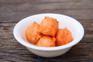 Crispy snack meatballs on wood background