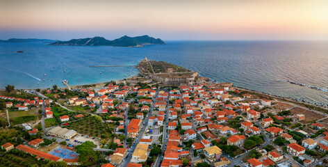 Aerial sunset view of the village of Methoni, Messinia, Greece, with the ancient castle and Sapienza island in the background