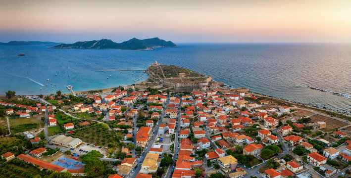 Aerial sunset view of the village of Methoni, Messinia, Greece, with the ancient castle and Sapienza island in the background