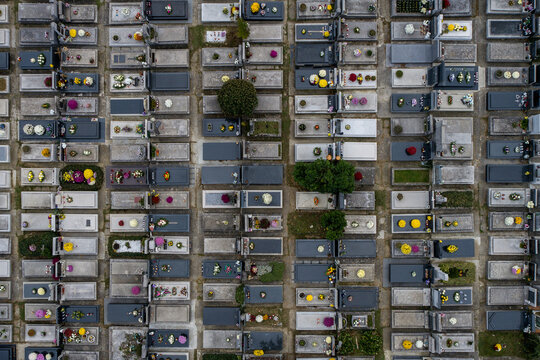 Aerial view of the meticulously arranged gravesites, a tapestry of stone and flora, creates a somber yet beautiful scene, Zagreb, Croatia.