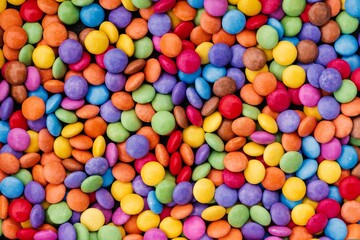 Obraz premium Indulge in vibrant colors with this tempting candy background, perfect for sweet promotions, playful designs, and cheerful holiday celebrations