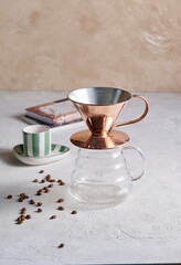 Classic pot displayed on a clean surface, highlighting its metallic texture and iconic coffee-brewing design.