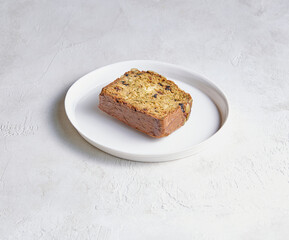 A plate filled with assorted cake and pastry pieces, photographed to highlight texture, color, and appetizing detail.