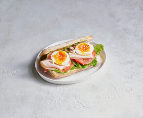 Freshly prepared breakfast plate with eggs served on a clean surface, highlighting color, texture, and appetizing presentation.