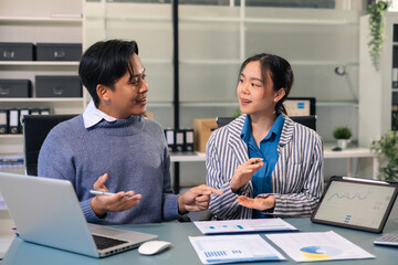 Business corporate team brainstorming, planning strategy having a discussion with chart at office...