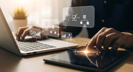 A person is working on a laptop and tablet, with digital icons floating above the devices, representing data analysis, task management, and workflow automation in a modern office setting