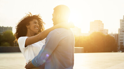 Enjoy moment. Loving couple hugging at sunset, copy space