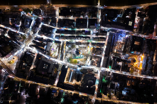 Aerial view of a vibrant city square illuminated at night, casting bright light on the surrounding buildings and streets, Sarajevo, Federation of Bosnia and Herzegovina, Bosnia and Herzegovina.