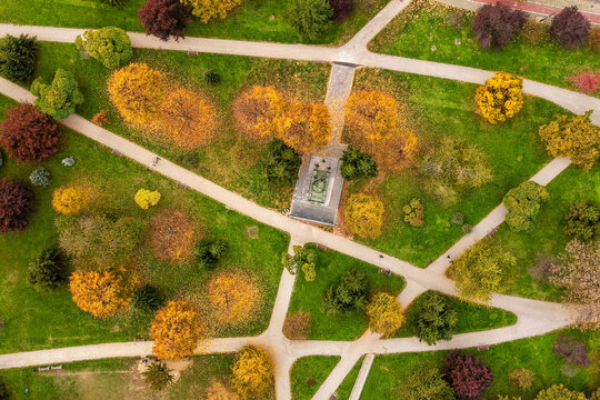 Aerial view of the intertwined pathways cutting through a vibrant, autumnal park with trees displaying a mosaic of warm colors, Sarajevo, Federation of Bosnia and Herzegovina, Bosnia and Herzegovina.