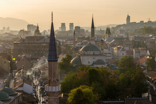 Aerial view of the Gazi Husrev-beg Mosque's green dome and minaret piercing the skyline amid a golden cityscape, Sarajevo, Federation of Bosnia and Herzegovina, Bosnia and Herzegovina.