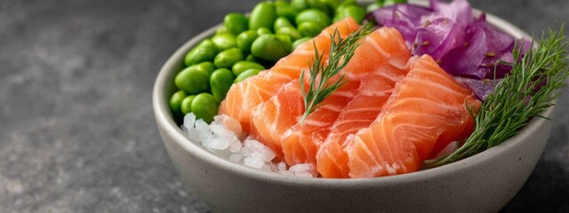 Bright salmon slices rest atop a bed of white rice, surrounded by fresh edamame, purple onion, and green herbs. This healthy poke bowl is perfect for a nourishing midday meal