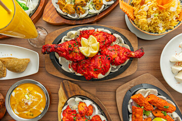 A traditional roasting scene where Tandoori chicken is cooked to perfection, showcasing its juicy textures and smoky aroma