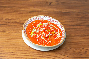 A feast for the senses: a photograph showcasing the smooth texture of the Tikka Masala sauce and the spices that promise an unforgettable flavor