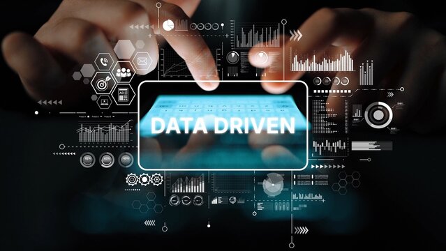 Hands Typing on Digital Keyboard Surrounded by Data Visualization and Analytics in a Modern Technology Concept. Asymptotic smart data analytic. - Powered by Adobe