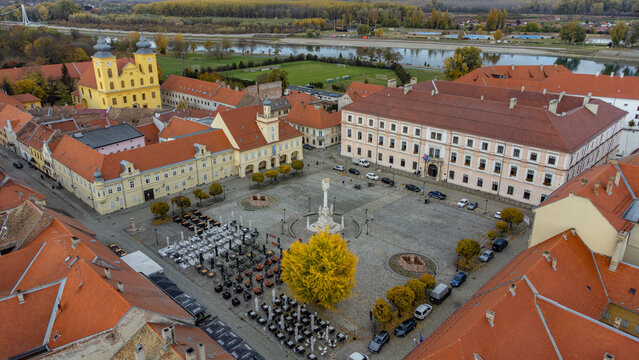 Aerial view of the Holy Trinity Monument standing tall on the Ante Starcević Square surrounded by baroque architecture, Osijek, Osijek-Baranja County, Croatia.