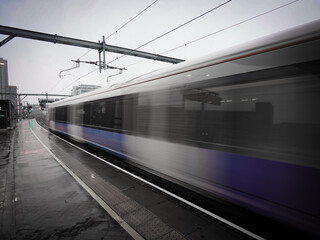 Train departing a UK station