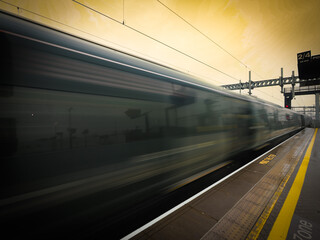 Train departing a UK station
